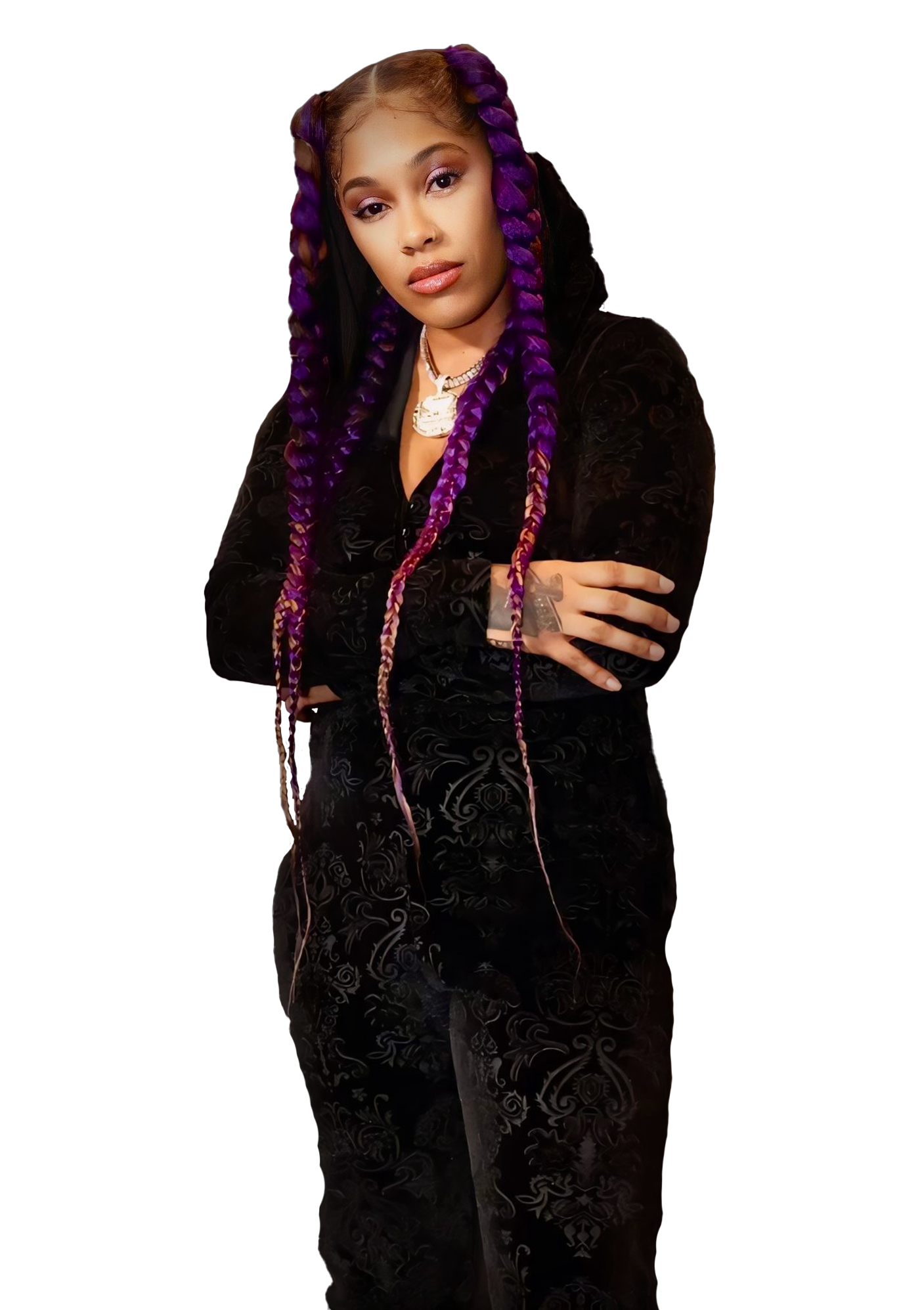 PZB with arms crossed in a black suit and purple braids